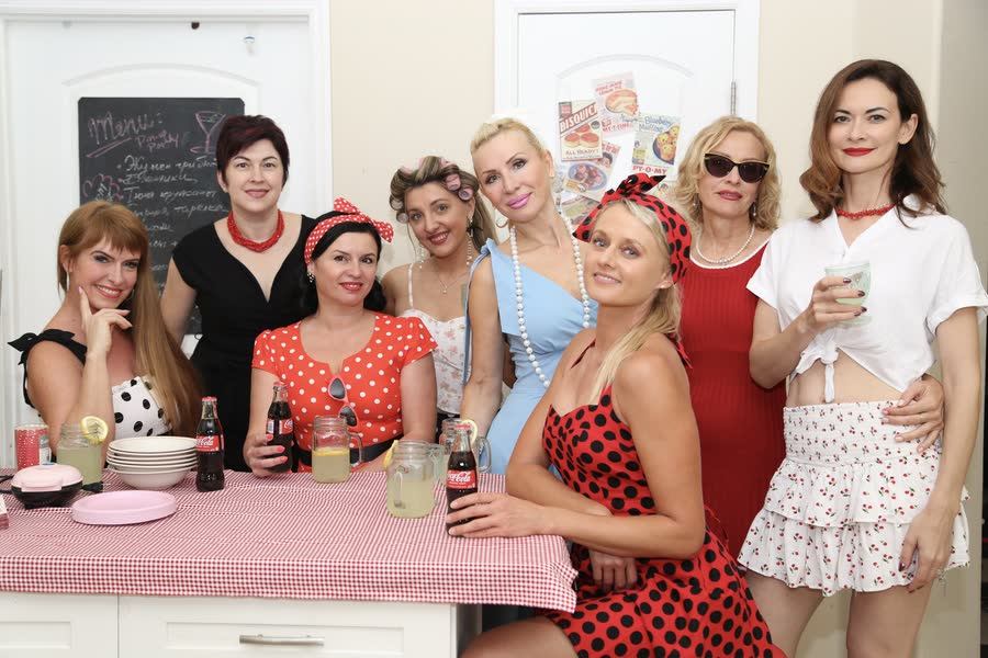 Group of women in retro pin-up styling at a themed photo event in Sarasota