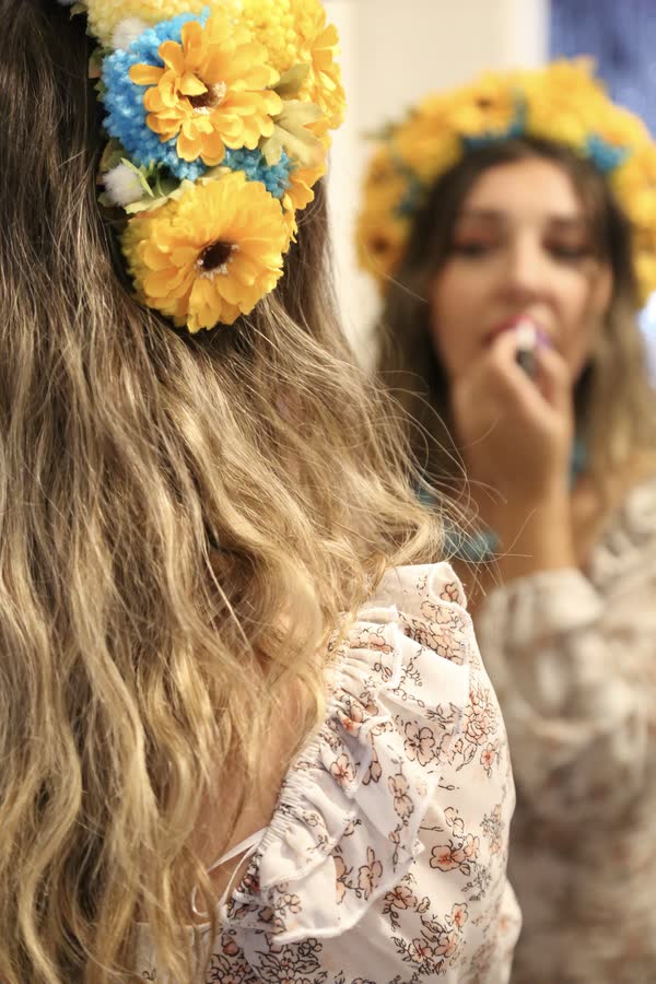 Portrait of a woman wearing a floral crown at a themed photo event
