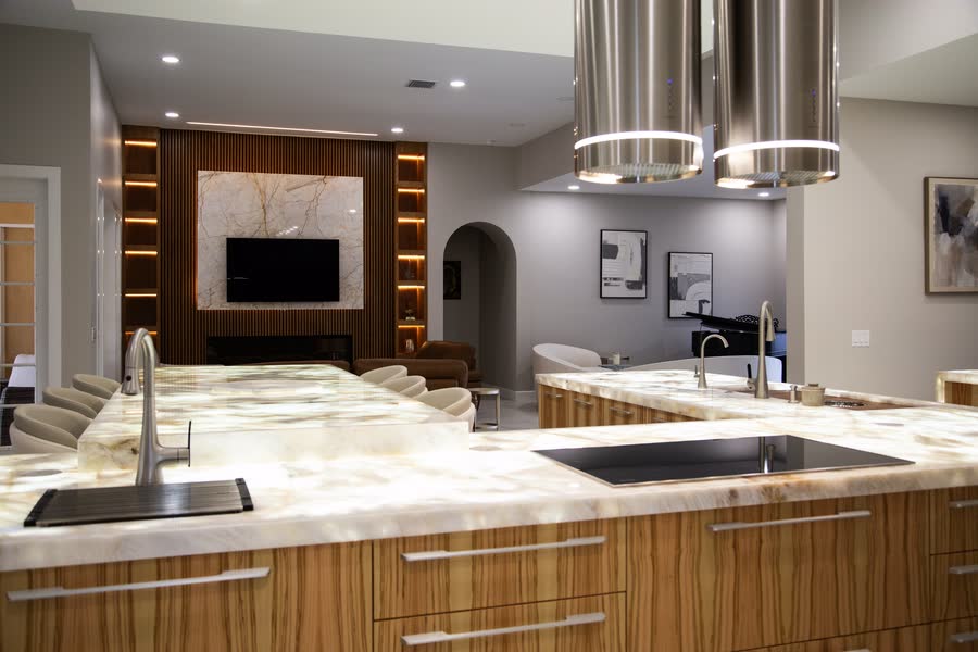 Modern wood-grain kitchen with waterfall stone island